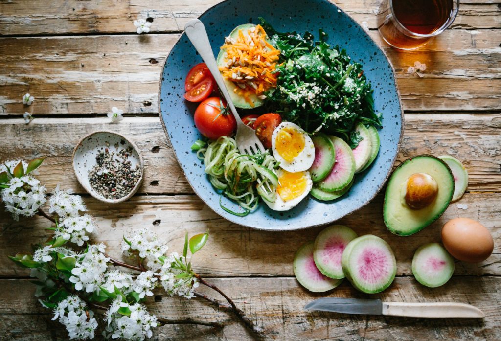 healthy meal in bowl on wood table